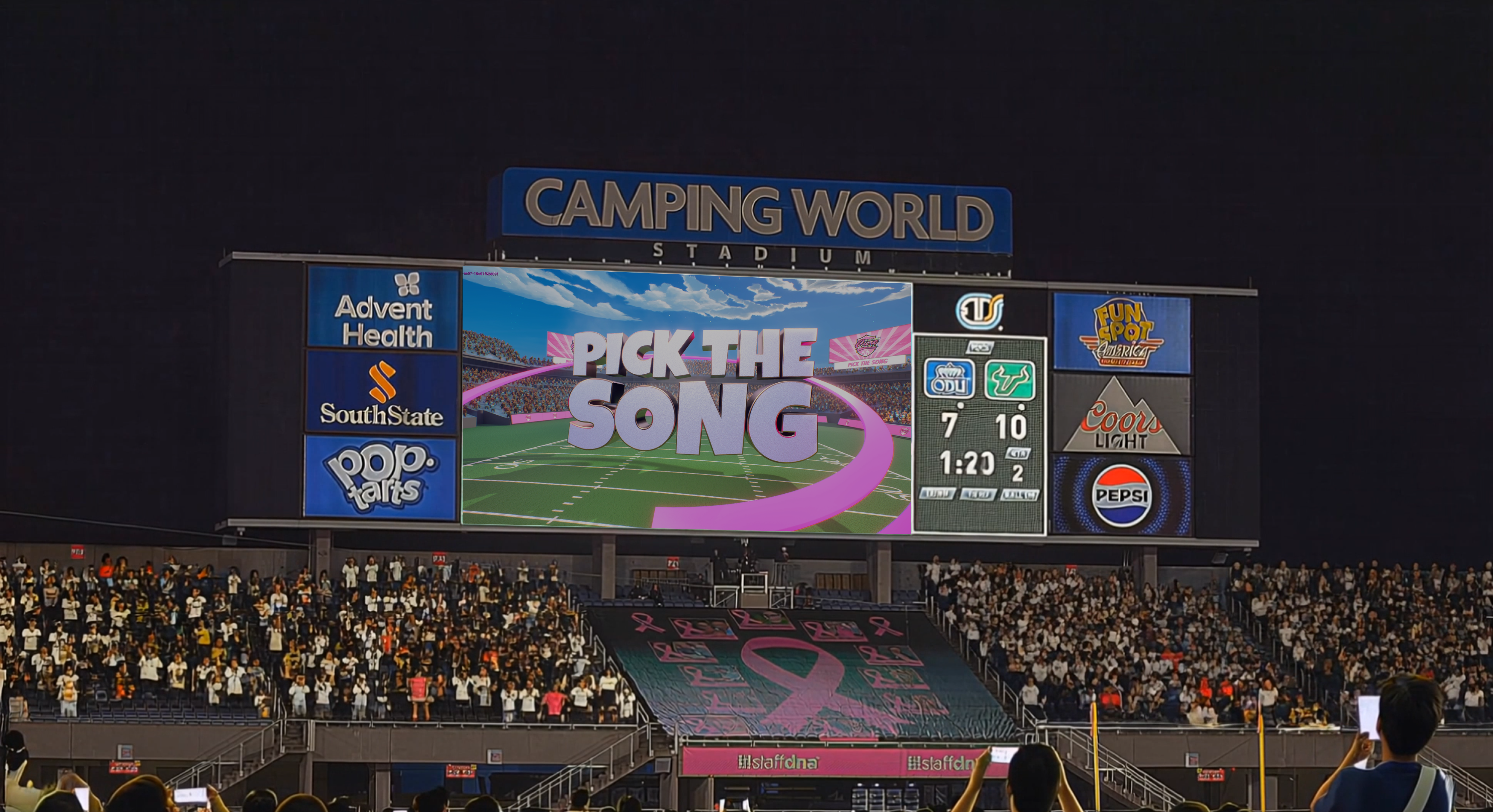 An image of a crowded sports arena where the main jumbotron shows an interactive song polling game, highlighting fans participating in a live, screen-driven experience.